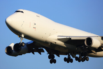Boeing747-400 All White Colours cargo Aircraft landing.