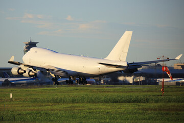 Fototapeta na wymiar B747-400 All White Colours cargo Aircraft landing at Narita International Airport