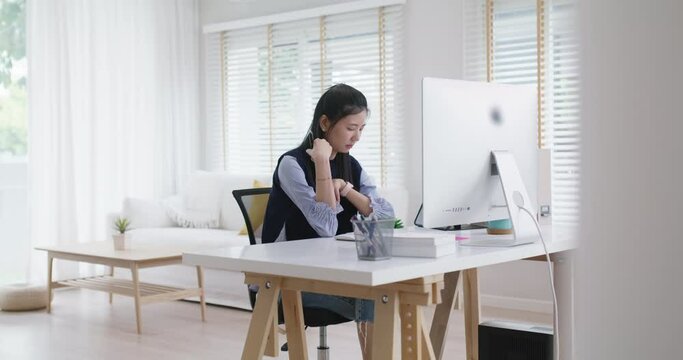 Young asia people female workforce sit on desk table remote work at home office workspace look away concern of plan risk in analyst job career. Teen girl lady think hard doubt pensive in online class.