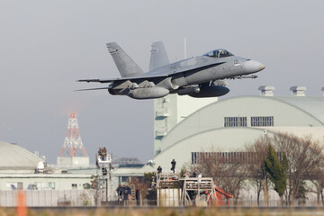 USMC F/A-18C fighter plane taking off from the base