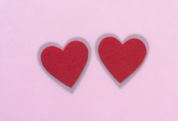 two felt heart with shadowy border on pink