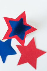 blue and red stars (some out of focus) on a white background