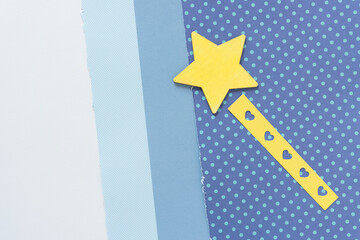 "shooting" grungy wood star painted yellow with yellow paper tail decorated with small hearts