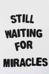 still waiting for miracles - black chalk letters