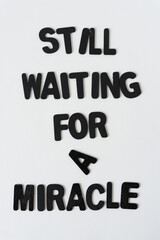 still waiting for a miracle - black chalk letters