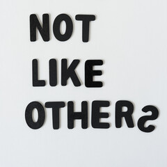 not like others - black chalk letters