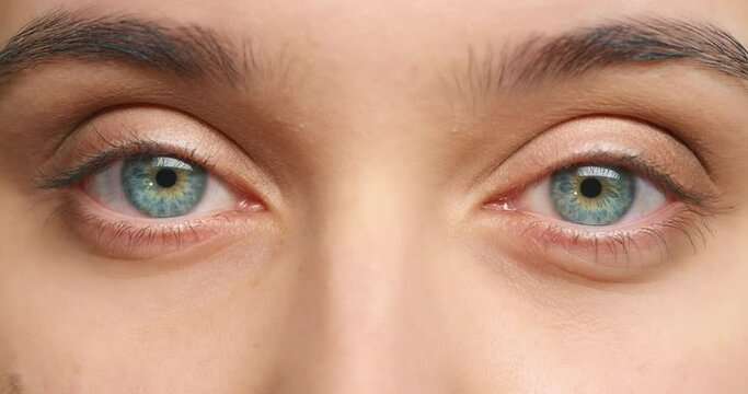 Blue eye, eyesight and vision of woman blink for optometry, wellness and healthcare. Looking, awareness or staring with macro, zoom or closeup of medical examination of human iris anatomy