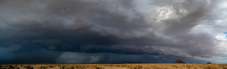 Obraz na płótnie Canvas Panoramic view of a storm clouds over the Mojave Desert