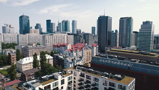 Drone view of center of Warsaw Poland. Modern apartment buildings and reflective skyscrapers. Daylight cityscape. Horizontal. High quality 4k footage