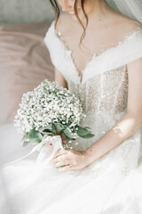 bride holding gentle wedding bouquet