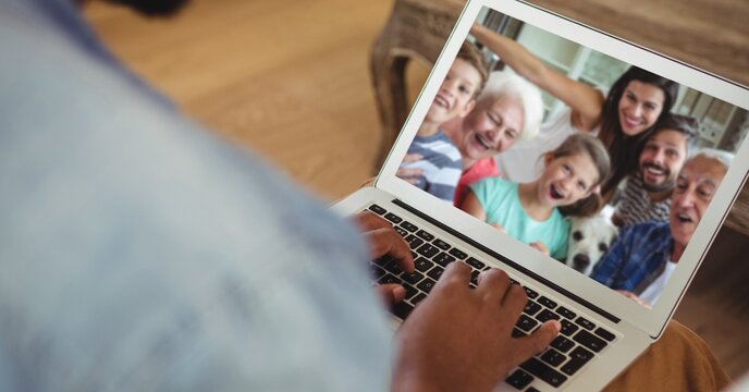 Family having video call on laptop - Powered by Adobe