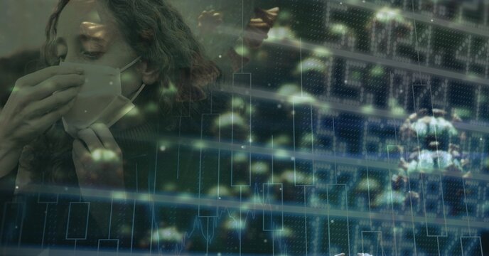 Covid-19 cells and stock market data processing against woman wearing face mask sneezing 