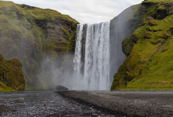 Skógafoss waterfall in the mountains