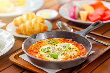 Healthy breakfast with Shakshouka or shakshuka on iron pan
