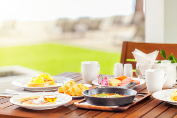 Healthy breakfast in outdoors cafe full of various colorful food