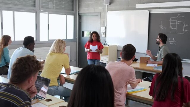 4k video of African American teen female high school student giving oral class presentation in front of classmates