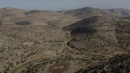 Aerial view over Samaria desert mountains 

Northern Samaria, Drone shot of arid landscape, Israel
