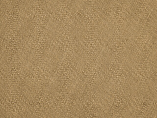 Light brown woven surface closeup. Linen textile texture. Fabric sewing elegant background. Textured braided home backdrop. Len wallpaper. Macro