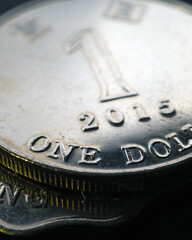 1 Hong Kong dollar. Fragment of textured coin. Vertical stories on the theme of economics or banking. Coins and money of Hong Kong. News about the exchange rate or inflation