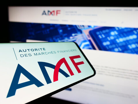 Stuttgart, Germany - 09-11-2022: Smartphone with logo of French regulator Autorite des Marches Financiers (AMF) on screen in front of website. Focus on center of phone display.