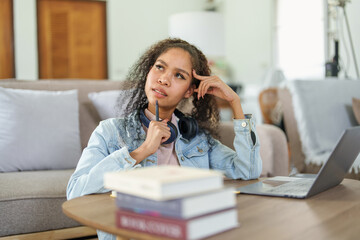 African American using computers and notebooks to study online