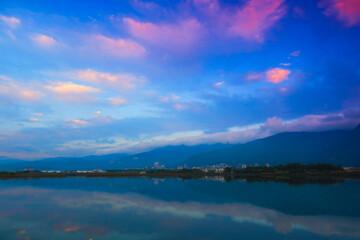 Lake at Sunrise and Mountains
