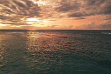 Beautiful red epic sunset sunrise and dramatic clouds over the dreamy sea - Bali