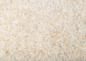 Long grain rice background. Uncooked white rice. Texture, wallpaper.