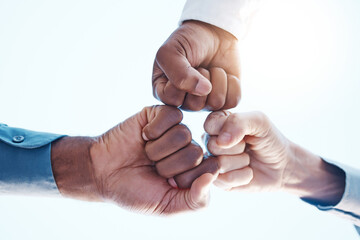 Fist bump, group support and team success in meeting at work, celebration of corporate win and team...