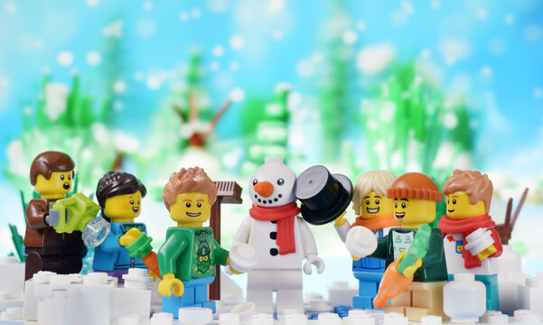 Lego minifigures happy cute children with snowman at winter.  Editorial illustrative image of active lifestyle with minifiggure serve 23.