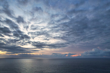 Beautiful red epic sunset sunrise and dramatic clouds over the dreamy sea - Bali