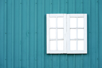 Naklejka na ściany i meble Blue wall with white window isolated on white background. This has clipping path.