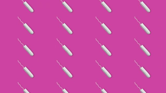 Looped animation on the theme of menstruation and women's critical days. Many women's period tampons move endlessly on a pink background. Background or element for motion design.