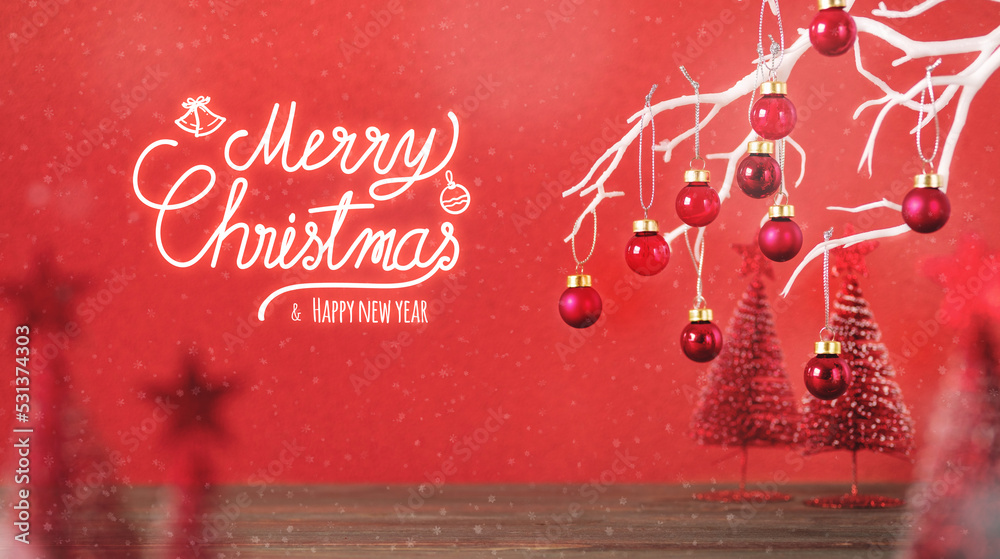 Poster Merry christmas and happy new year with xmas tree and bauble ball at vivid red wall at wooden table.copy space for adding design
