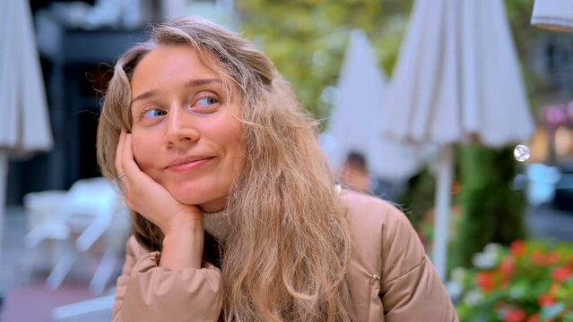 Bored woman tired to wait for food at a terrace