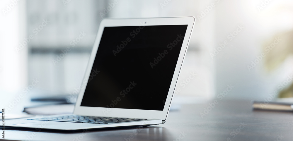 Aufkleber digital, laptop and black screen mock up on table surface in office building for marketing, design a