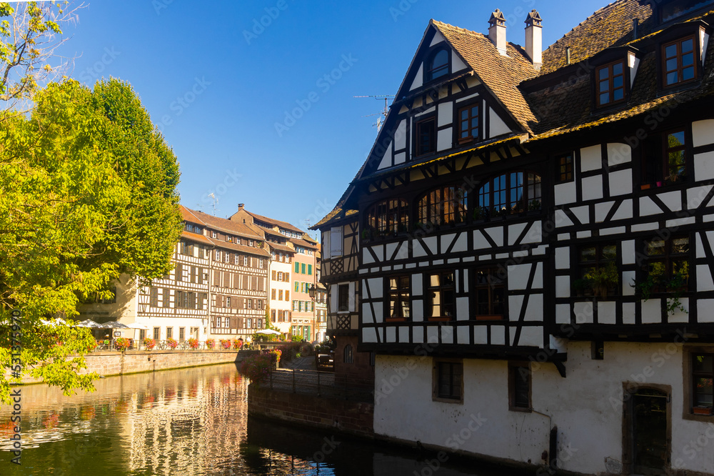 Wall mural picturesque view of old french town of strasbourg with canals and ancient fachwerk houses at sunny s