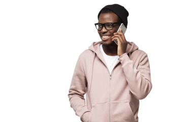 Horizontal shot of young African American man in casual clothes and glasses pictured looking sidewards while talking to friend on phone