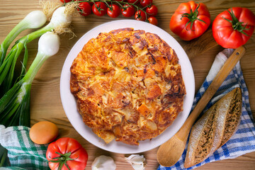 Potato and sweet potato omelette. Modern Spanish recipe of the traditional tortilla tapa.