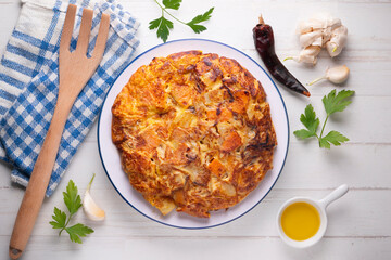 Potato and sweet potato omelette. Modern Spanish recipe of the traditional tortilla tapa.