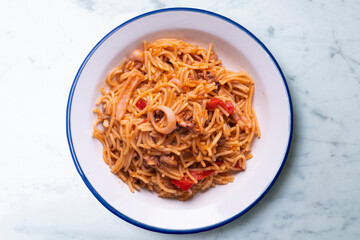 Fideua with squid and seafood. Typical Spanish tapa cooked with paella.