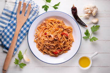 Fideua with squid and seafood. Typical Spanish tapa cooked with paella.