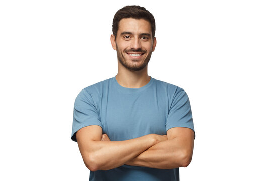 Indoor portrait of young european man standing in blue t-shirt with crossed arms, smiling and looking at camera