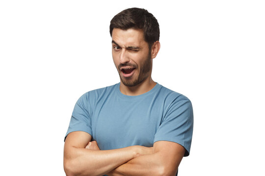 Studio shot of young man winking while flirting