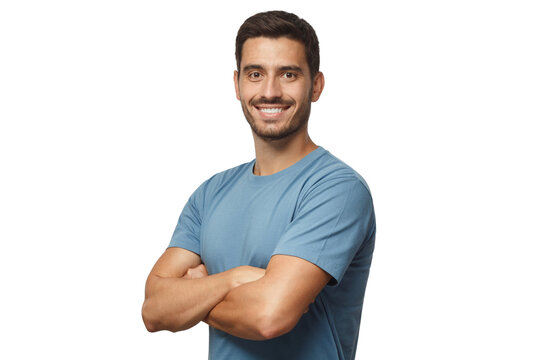 Smiling handsome young man in blue t-shirt standing with crossed arms