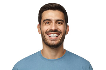 Close up horizontal shot of handsome smiling broadly unshaven young man in blue tshirt laughing out...