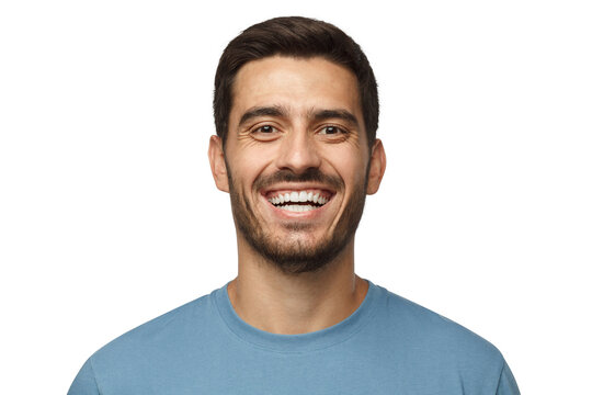 Close Up Horizontal Shot Of Handsome Smiling Broadly Unshaven Young Man In Blue Tshirt Laughing Out Loud