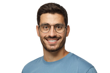 Indoor headshot of young handsome man dressed in blue t-shirt, wearing trendy round glasses, looking at camera with calm face expression and happy smile