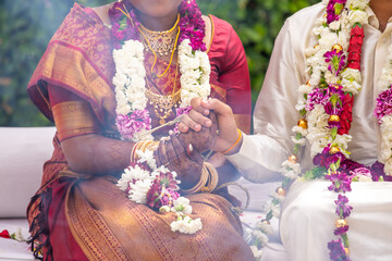 Fototapeta na wymiar South Indian Tamil couple's holding hands close up