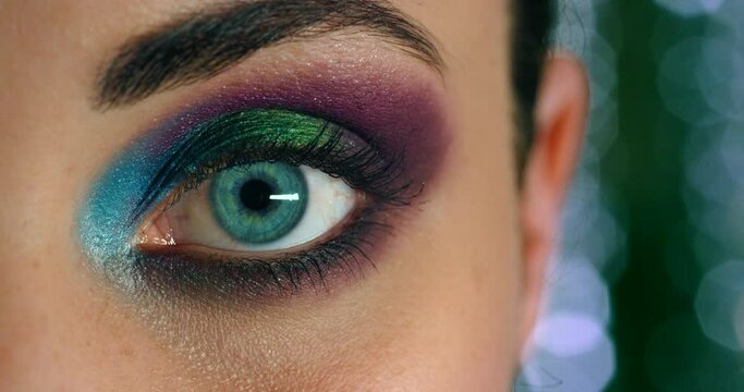 Makeup, beauty and eye woman model with cosmetics, skincare or creative eyelash fashion or mascara zoom. Microblading, portrait and cyberpunk makeup artist with eyeshadow, cosmetic and bright color